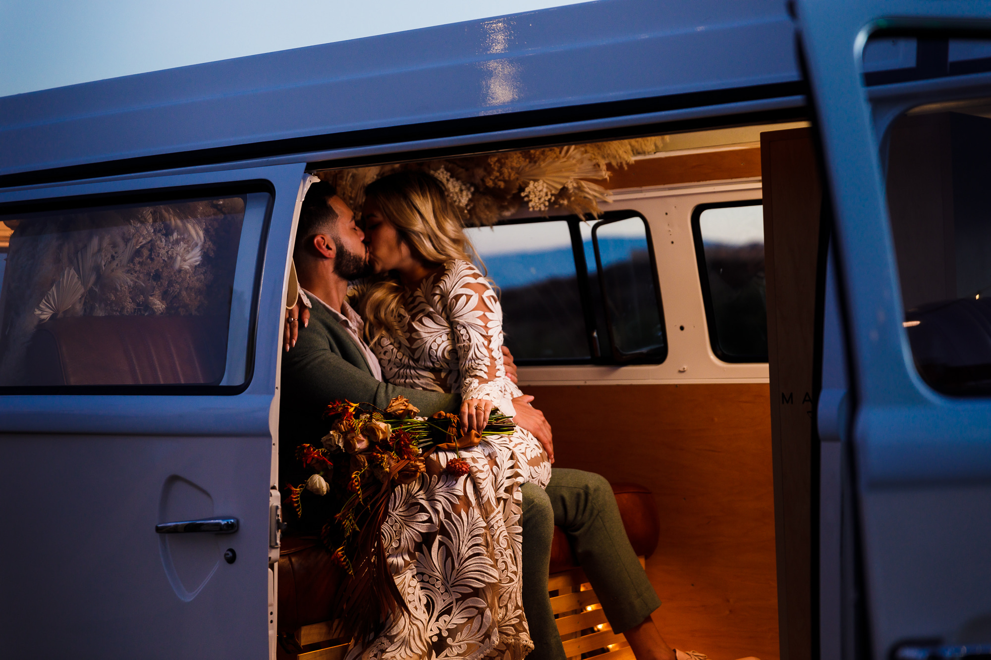bride and groom in photo bus